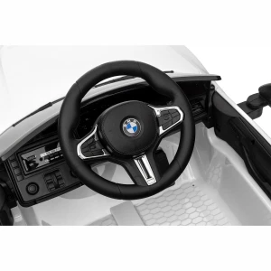 Mocne BMW M4 Dla Dzieci z Licencją 12V 14Ah, 2x45W, SX2418 - Biały - kierownica.webp