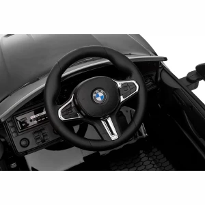 Mocne BMW M4 Dla Dzieci z Licencją 12V 14Ah, 2x45W, SX2418 - Czarny - kierownica bmw dla dzieci.webp