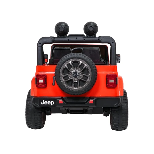 Pomarańczowy Jeep Wrangler na akumulator od tyłu – zapasowe koło na klapie, lampy LED i zderzak z napisem Jeep w aucie dla dzieci.webp