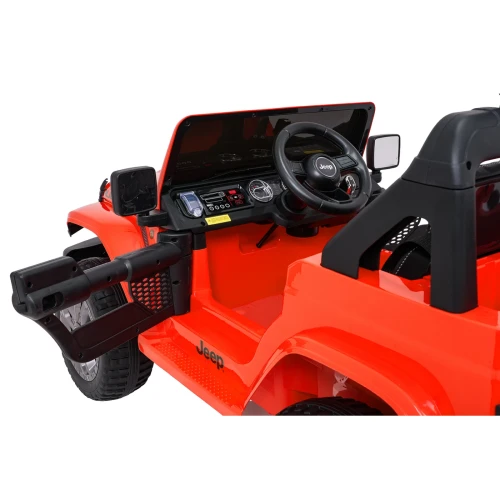 Kabina auta elektrycznego Jeep Wrangler Rubicon – kierownica z logo, deska rozdzielcza i szyba przednia w pomarańczowym pojeździe dla dzieci.webp