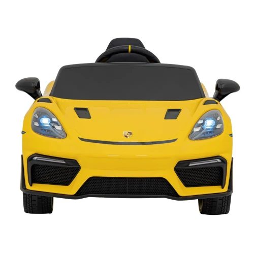 Widok z przodu z podświetlonymi reflektorami LED – żółte Porsche Spyder RS 718 na akumulator dla dzieci.webp