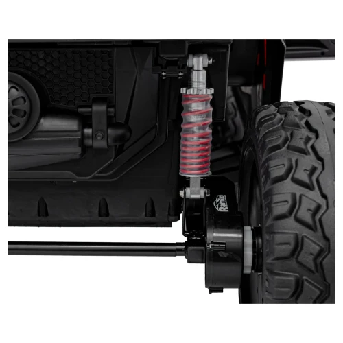 Amortyzator z czerwoną sprężyną i silnik napędu 4x4 – zawieszenie buggy Clash Strong na akumulator dla dzieci.webp