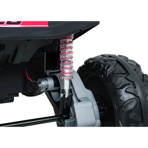 Amortyzator z czerwoną sprężyną, silnik napędu i koło terenowe – zawieszenie różowego buggy Turbo 23 4x4 na akumulator dla dzieci.webp