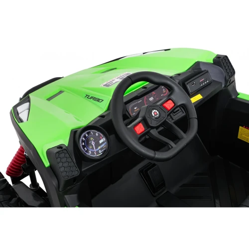 Kokpit z kierownicą, zegarem obrotomierza i napisem TURBO – wnętrze zielonego buggy Turbo 23 4x4 na akumulator dla dzieci.webp