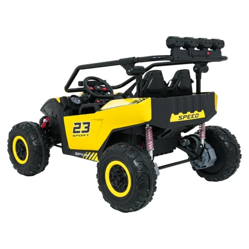 Ujęcie tyłu i boku z napisem SPEED, amortyzatorami i wałem napędowym 4x4 – żółte buggy Turbo 23 na akumulator dla dzieci.webp