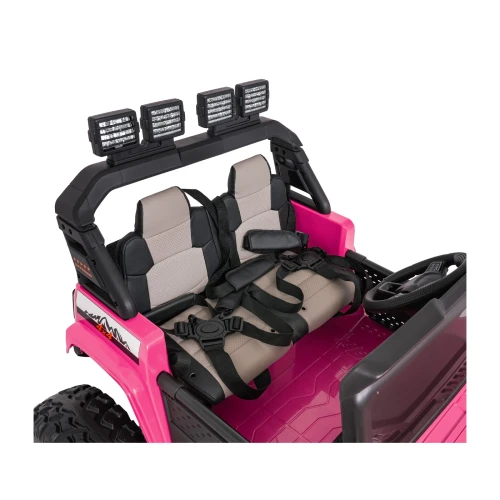 Dwa fotele z 5-punktowymi pasami bezpieczeństwa i klatka z halogenami LED – wnętrze różowego Extreme Sport 4x4 na akumulator dla dzieci.webp