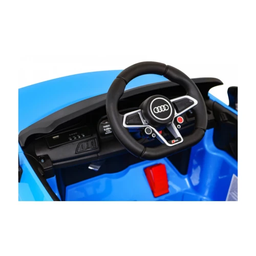 Kierownica z logo Audi, panel audio z portem USB i MP3 oraz pedał gazu – kokpit niebieskiego Audi R8 Lift na akumulator dla dzieci.webp