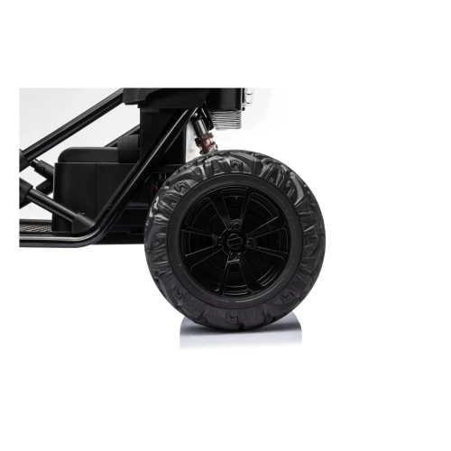 Tylne koło z czarną felgą i amortyzatorem – zbliżenie czarnego Buggy Sport Outland 4x4, pojazd na akumulator dla dzieci.webp