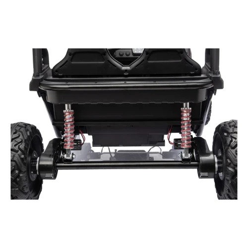 Tylna oś z dwoma amortyzatorami i silnikami w kołach – widok od tyłu różowego buggy Sport Outland 4x4 na akumulator dla dzieci.webp
