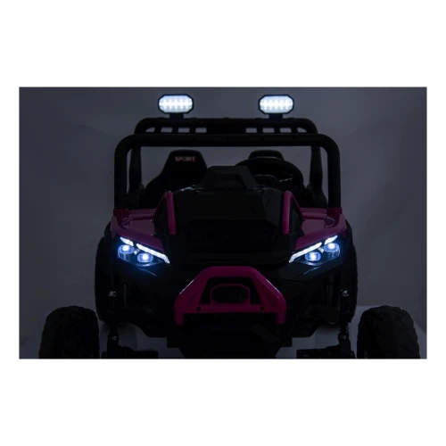 Świecące reflektory LED i lampy na dachu nocą – przód różowego buggy Sport Outland 4x4, efektowne oświetlenie auta na akumulator dla dzieci.webp